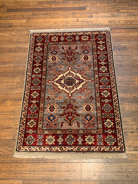 Hand-Knotted Vegetable Dye Kazak Rug from Pakistan, size 2' 10" x 4"